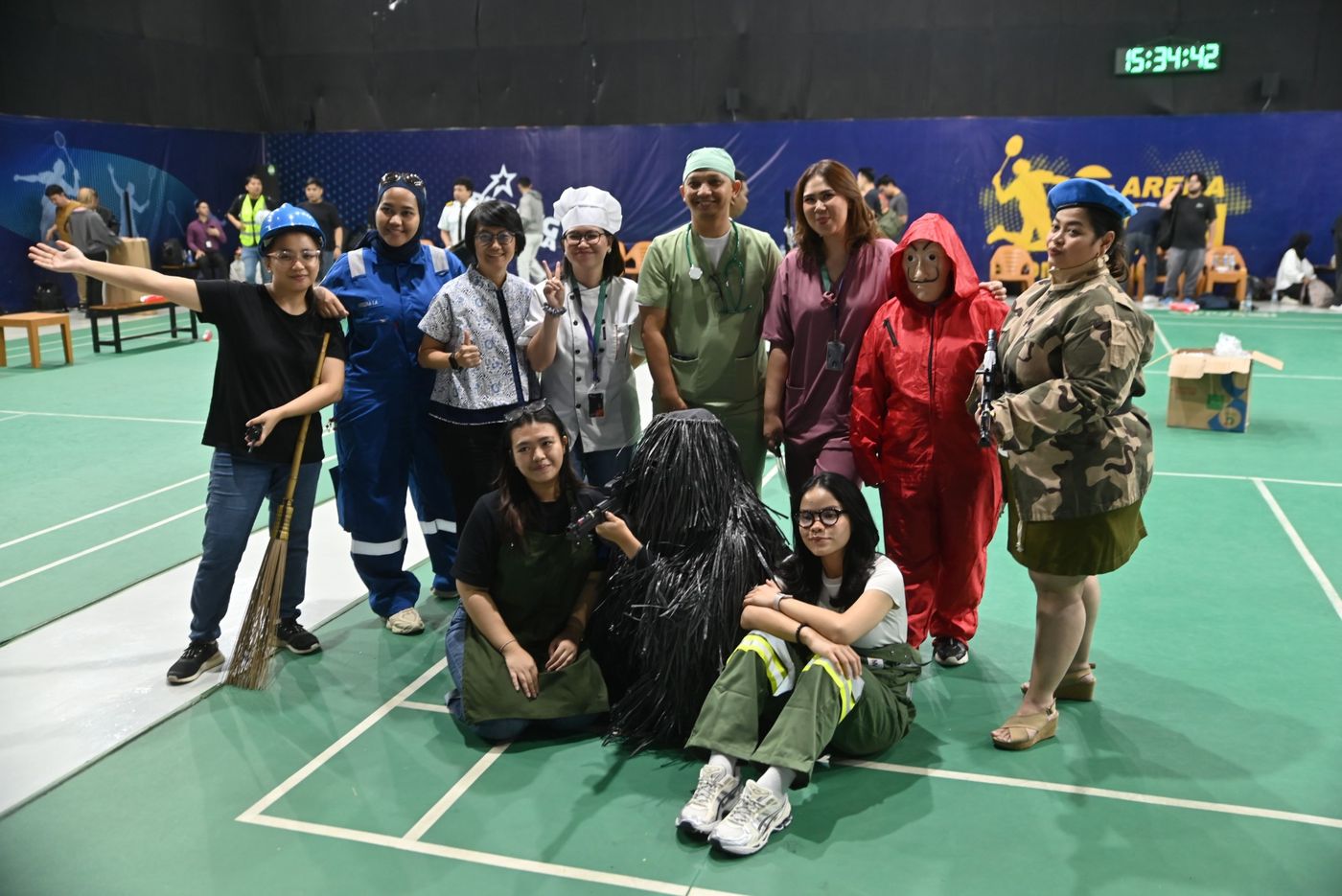 Team members in profession-themed costumes on a sports court
